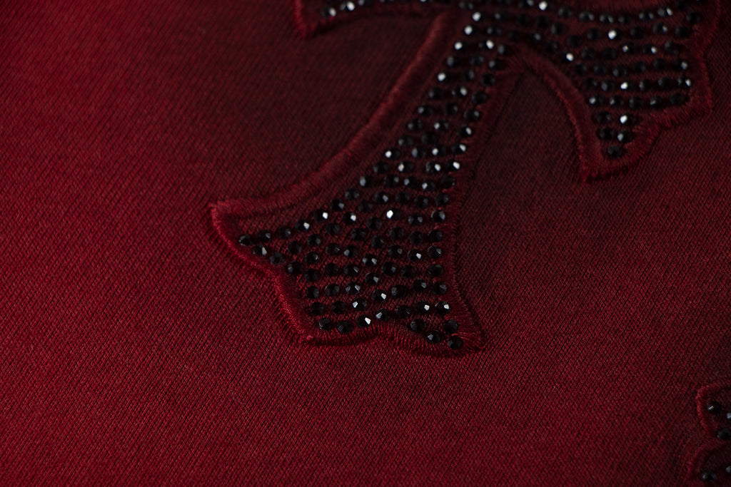 Burgundy fabric with dark jeweled star embroidery