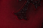 Burgundy fabric with dark jeweled star embroidery