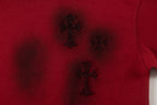 Burgundy T-shirt with dark embroidered cross and star motifs