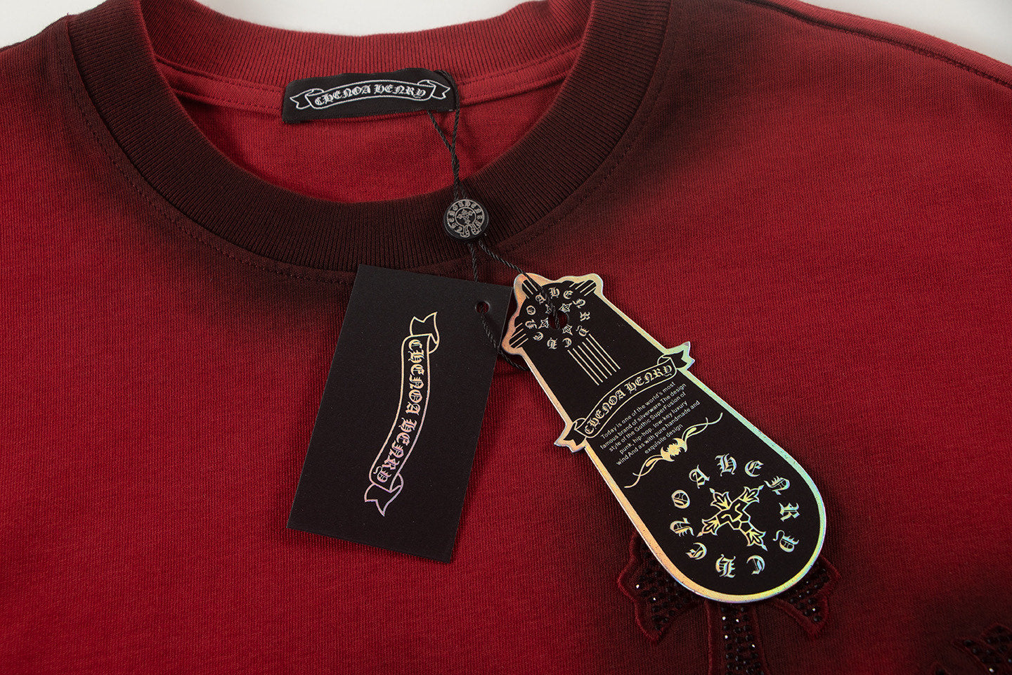 Burgundy crew-neck T-shirt with attached care tags