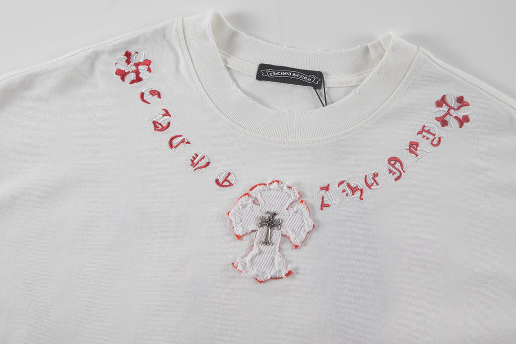 White short-sleeve T-shirt with red side embroidery and central heart-shaped cross motif