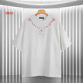 White short-sleeve T-shirt with red embroidered-style heart and cross motif at chest