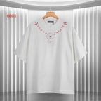 White short-sleeve T-shirt with red embroidered-style heart and cross motif at chest