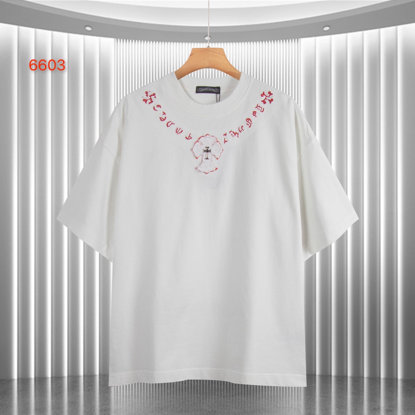 White short-sleeve T-shirt with red embroidered-style heart and cross motif at chest