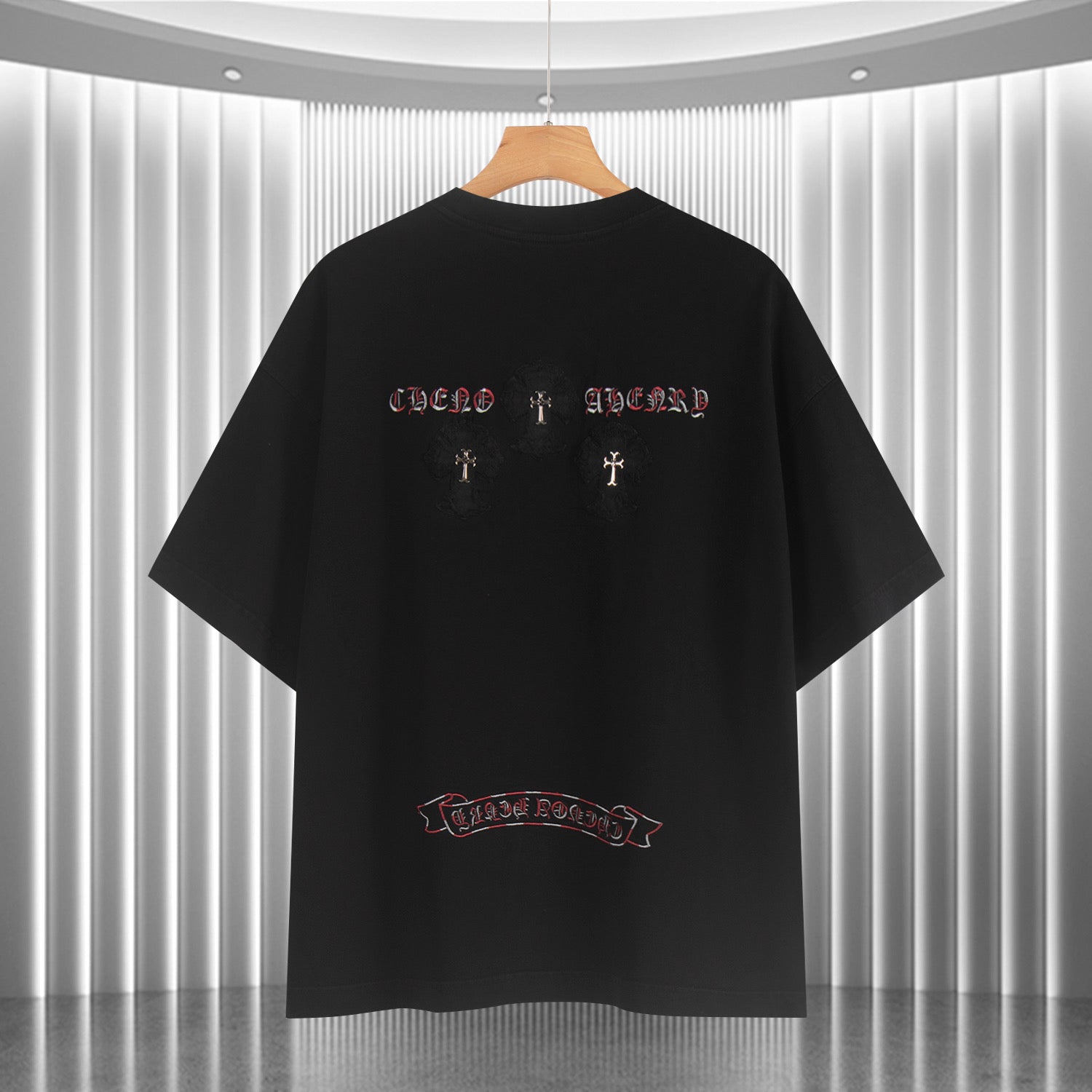 Black short-sleeve T-shirt back with red/white cross and emblem designs