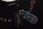 Black T-shirt with multicolor front graphic and hanging brand tag