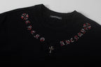 Black short-sleeve T-shirt with red cross motifs and central dark patch
