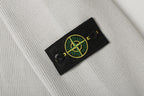Light gray knit jacket sleeve patch with Stone Island logo
