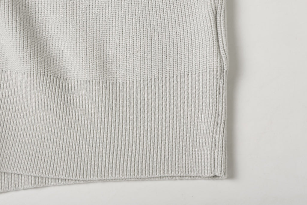 Light gray ribbed knit jacket hem cuff detail with clean edge