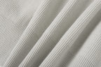 Light gray ribbed knit fabric panel detail on jacket sleeve