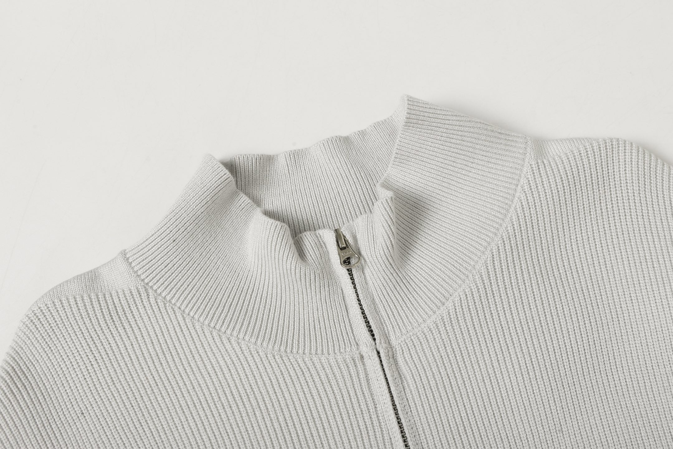 Light gray knit jacket stand collar with front zipper and metal pull
