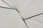 Light gray knit jacket front zipper with metal pull and stitched placket