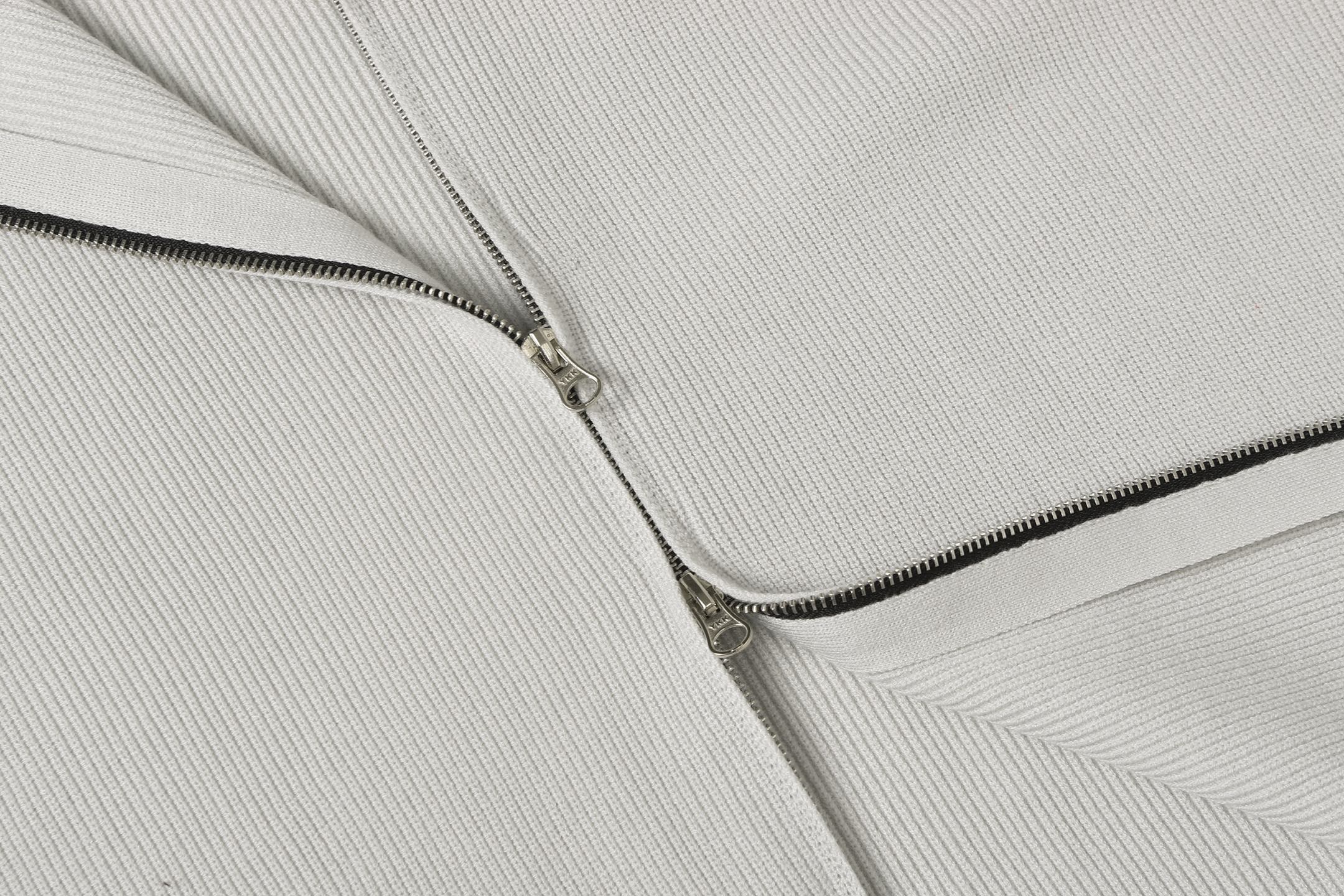 Light gray knit jacket front zipper with metal pull and stitched placket