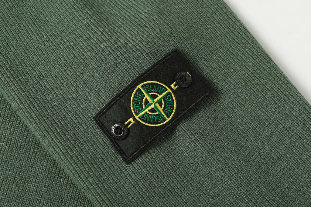 Stone Island logo patch on dark green knit sleeve cuff