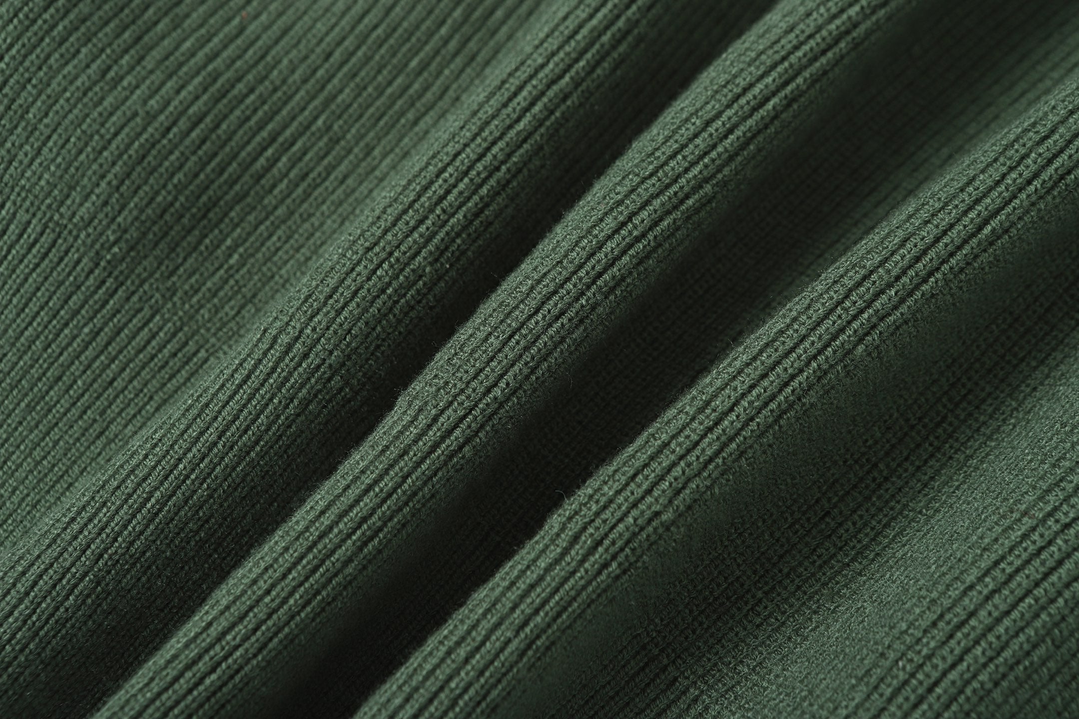 Stone Island zip jacket close-up of dark green knit sleeve seams
