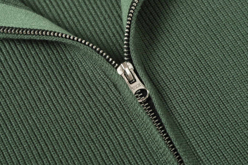 Stone Island dark green zip jacket close-up of metal zipper and rib-knit texture