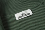 Stone Island brand patch on dark green rib-knit collar