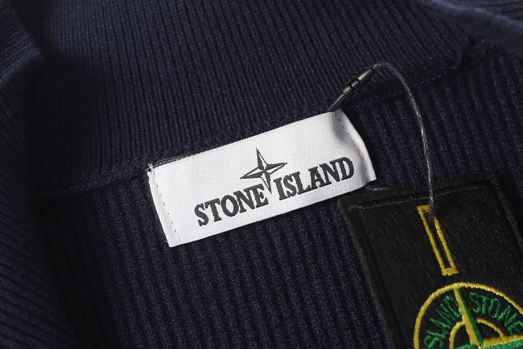 Stone Island brand label and logo patch on dark navy knit zip jacket