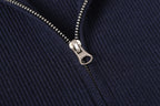 Stone Island metal zipper detail on dark navy knit jacket