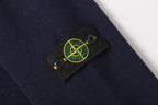 Stone Island logo patch on dark navy knit jacket sleeve