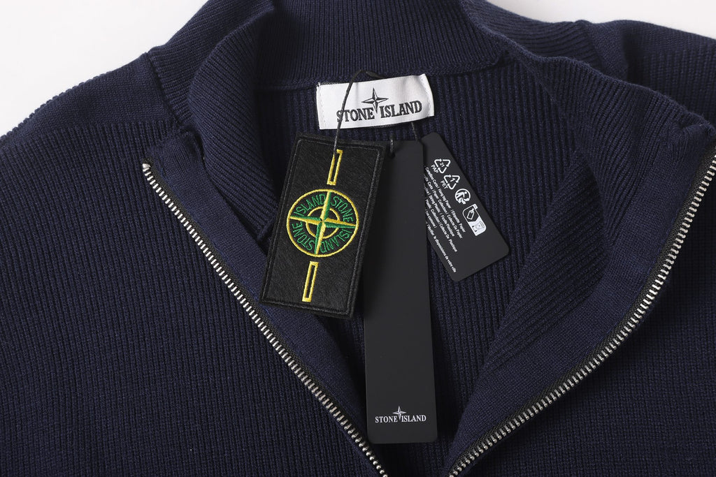 Stone Island knit zip jacket front with logo patch and silver zip pull, dark navy