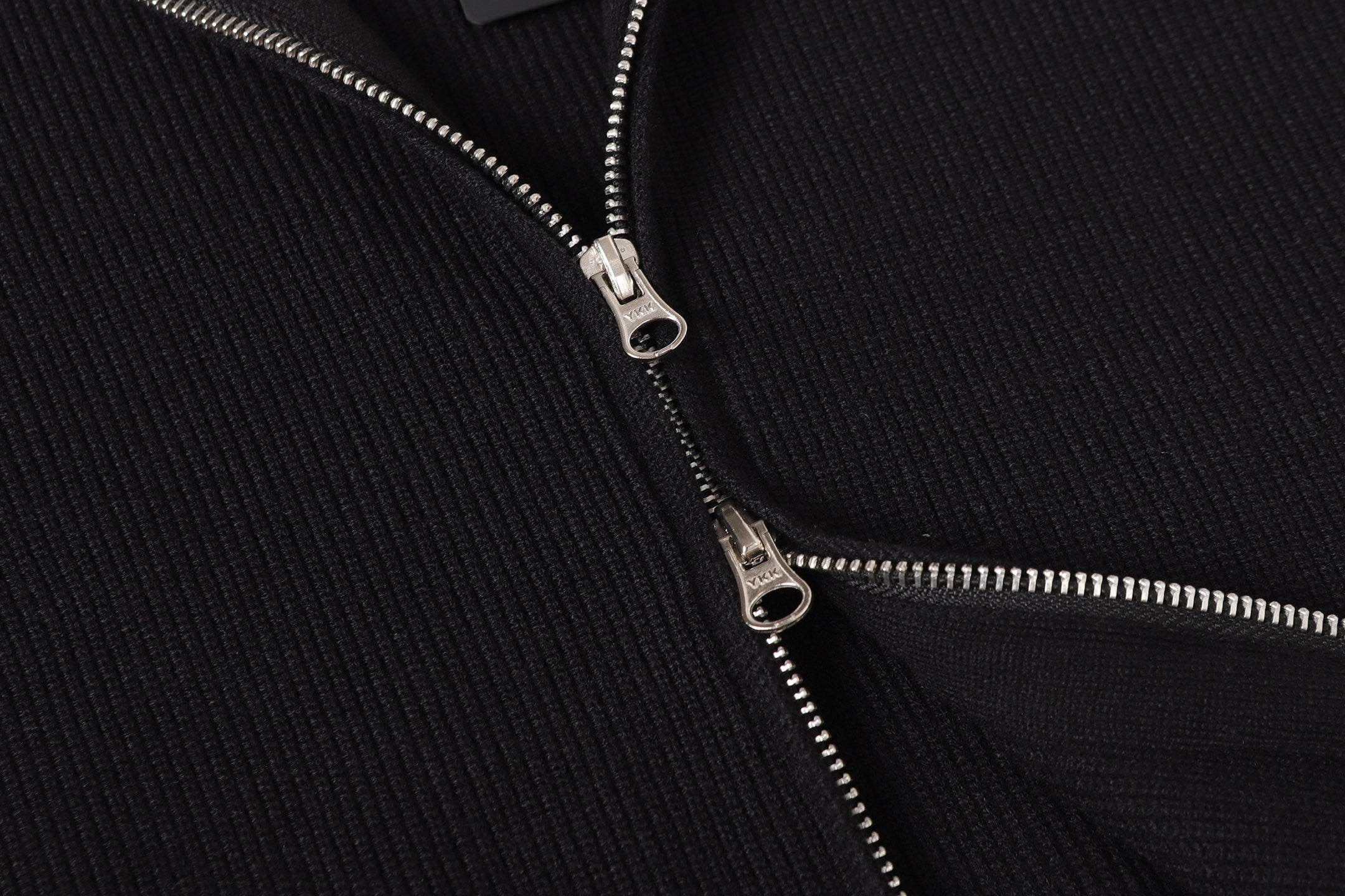 Stone Island black jacket zipper with silver pull and metal slider