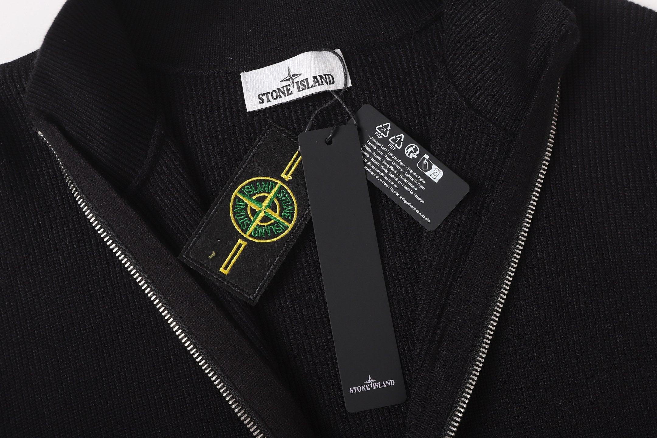 Stone Island jacket neckline with inner label and green yellow emblem patch