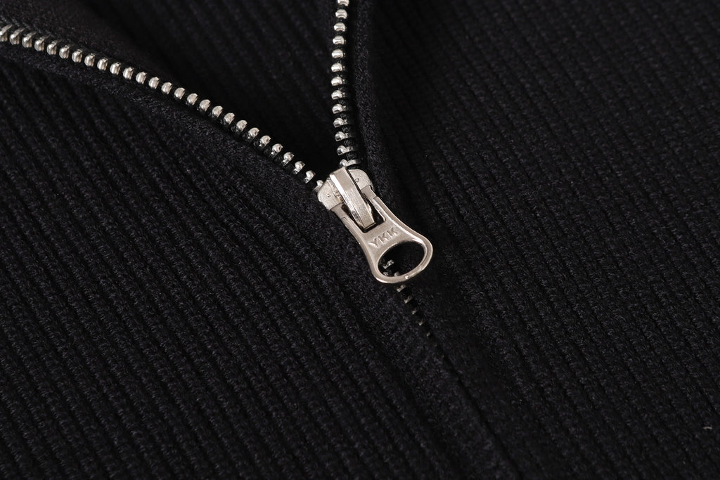 Stone Island black jacket zipper close-up with silver pull