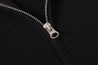 Stone Island black jacket zipper close-up with silver pull