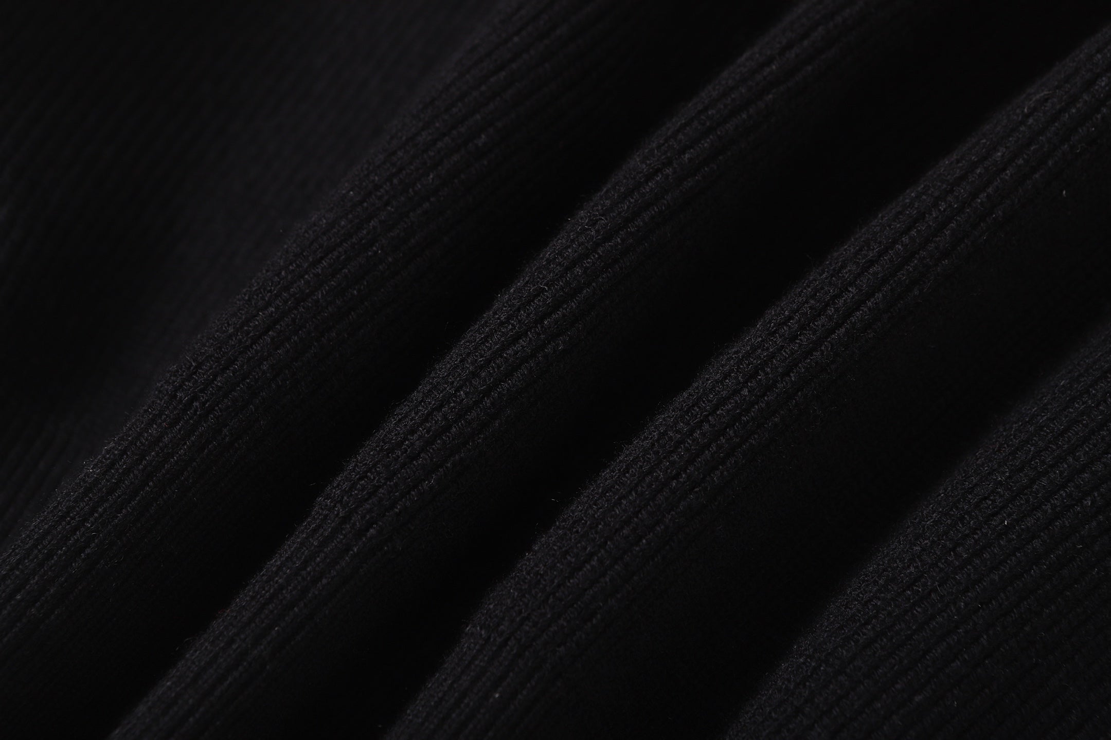 Stone Island black jacket ribbed fabric close-up on sleeve