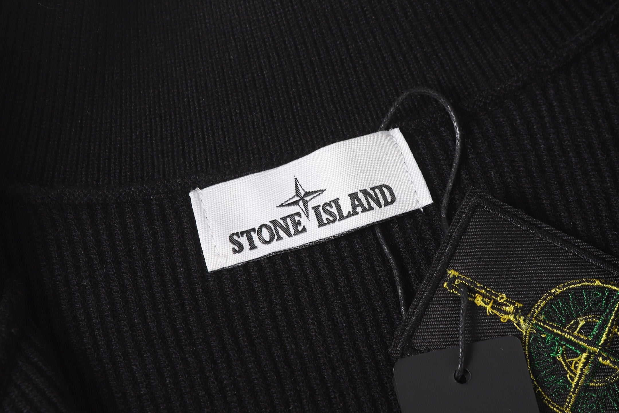 Stone Island black jacket collar with branded neck label and drawstring cord