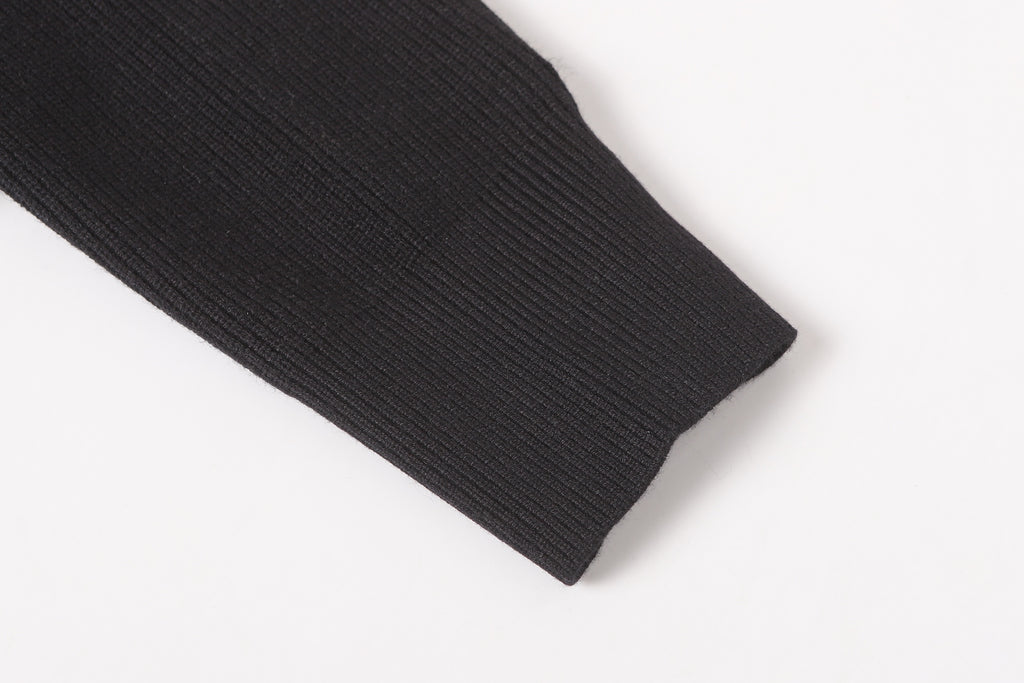 Stone Island black jacket sleeve cuff close-up with ribbed hem