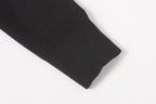 Stone Island black jacket sleeve cuff close-up with ribbed hem
