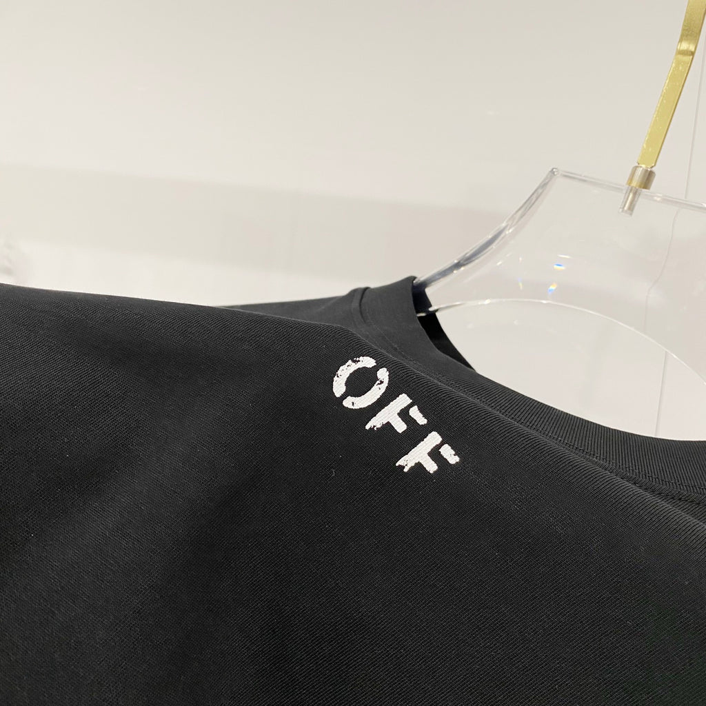 Black T-shirt close-up of OFF text logo on shoulder