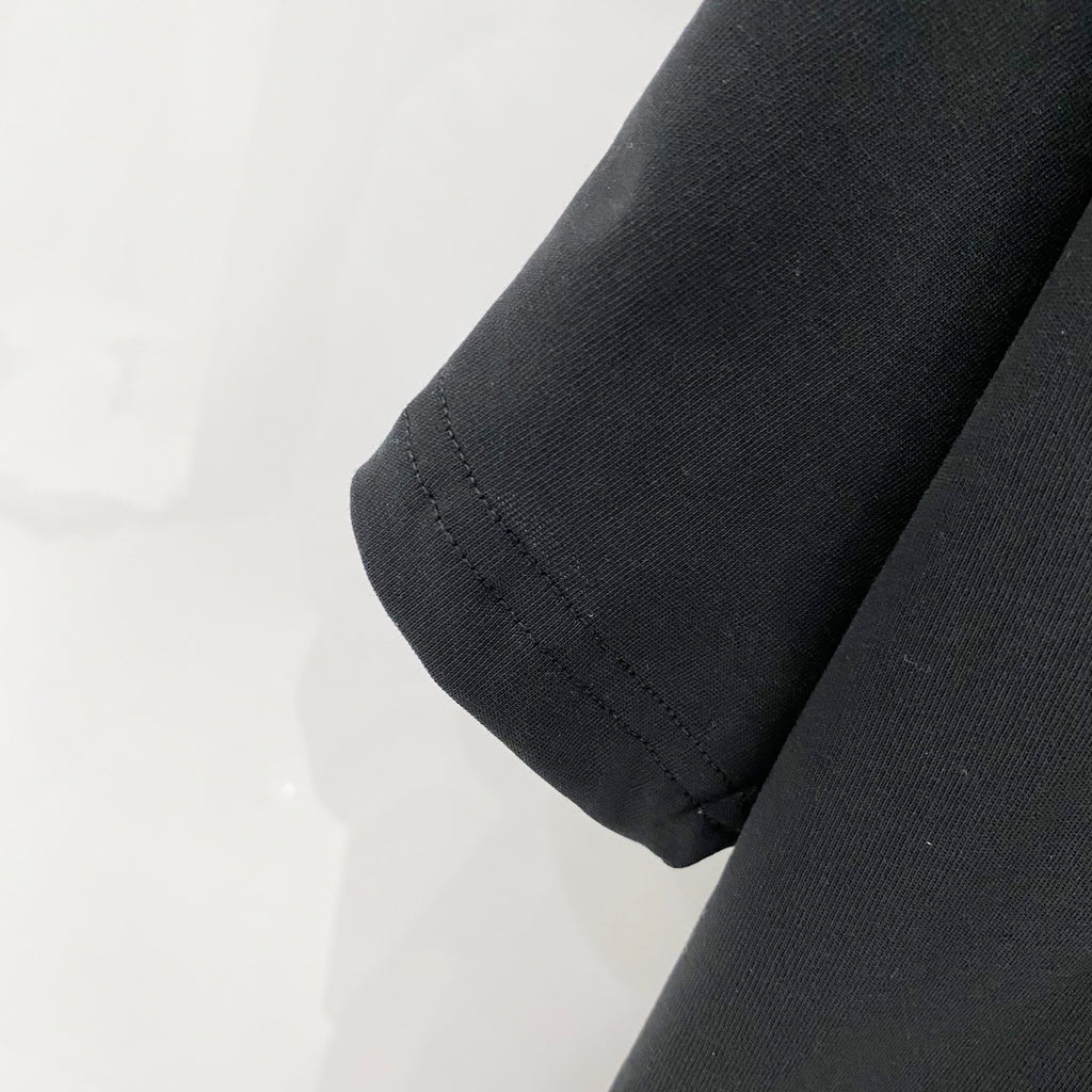 Black T-shirt sleeve hem with stitched cuff detail