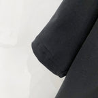 Black T-shirt sleeve hem with stitched cuff detail