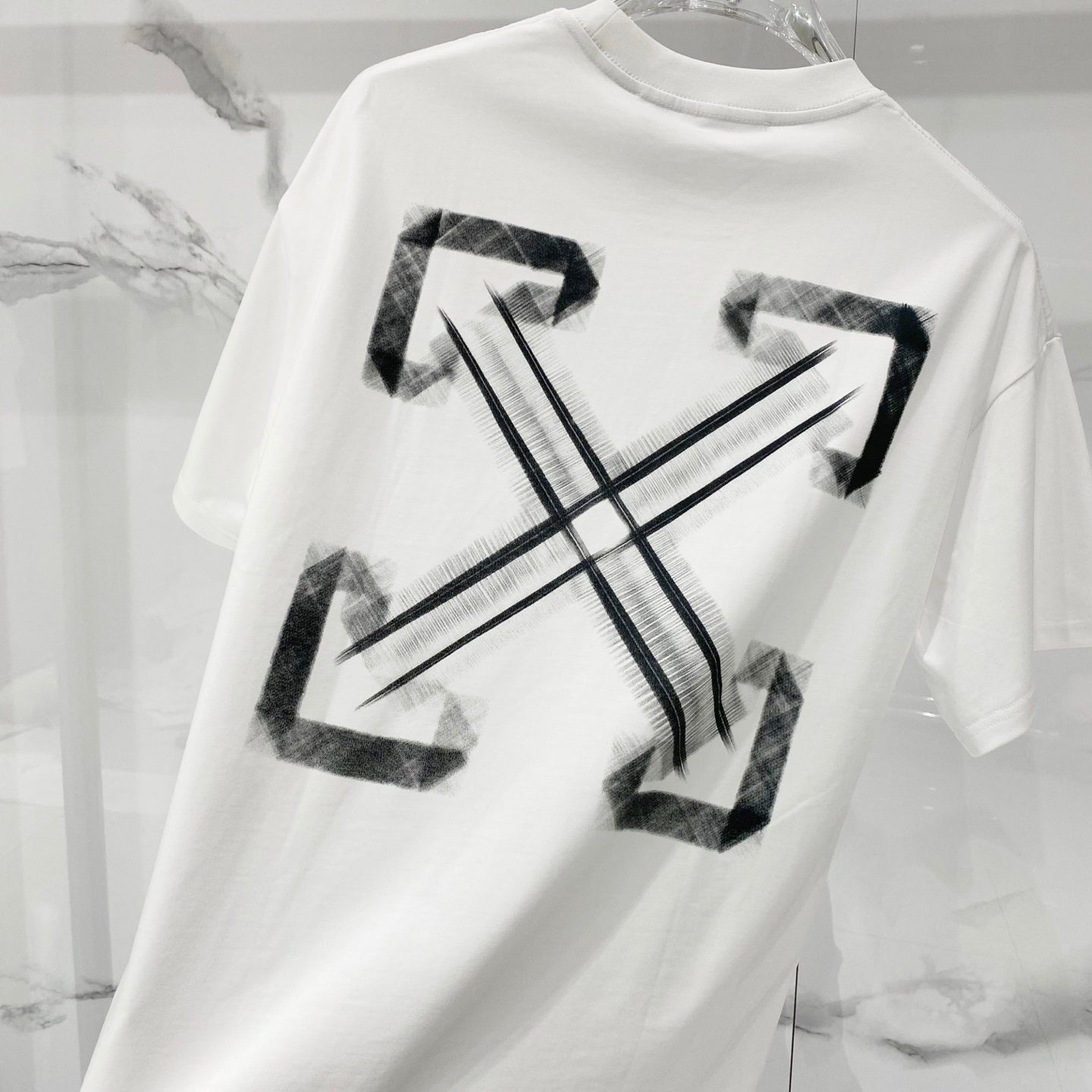 Off-white T-shirt back with large black arrow X graphic