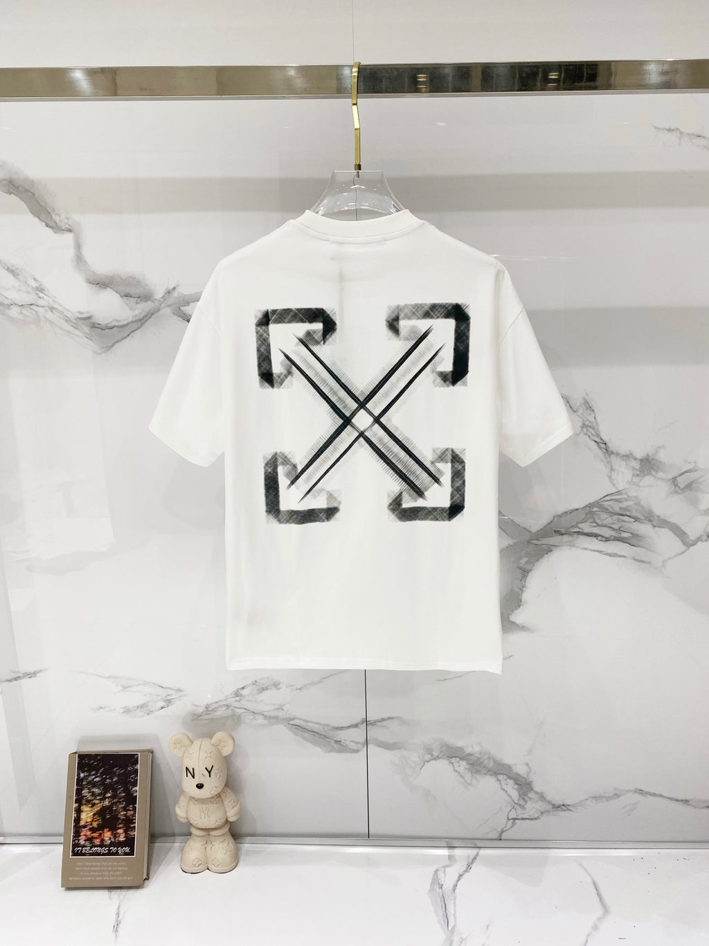 Off-white T-shirt with large black arrow X graphic on back