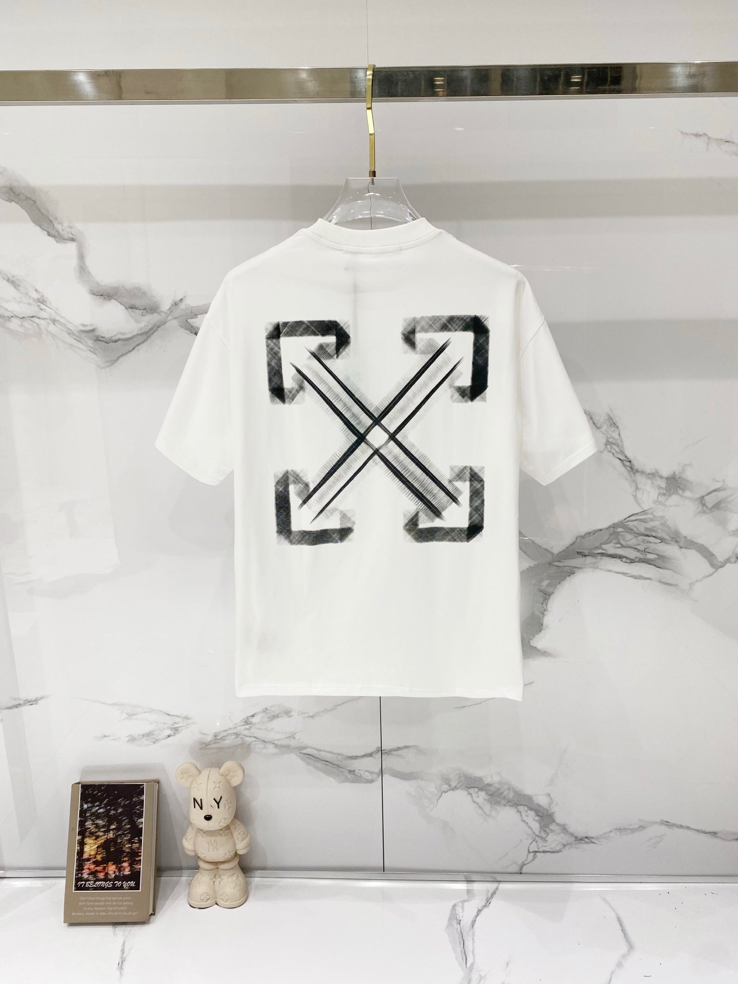 Off-white T-shirt with large black arrow X graphic on back