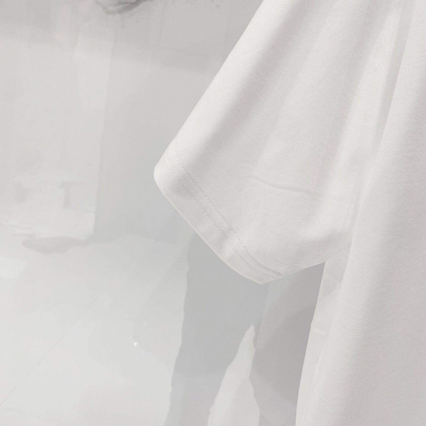 Off-white T-shirt sleeve and hem close-up