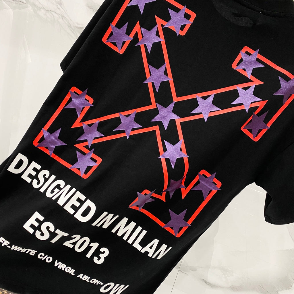Off-White black T-shirt with large star-arrow graphic and "DESIGNED IN MILAN" text