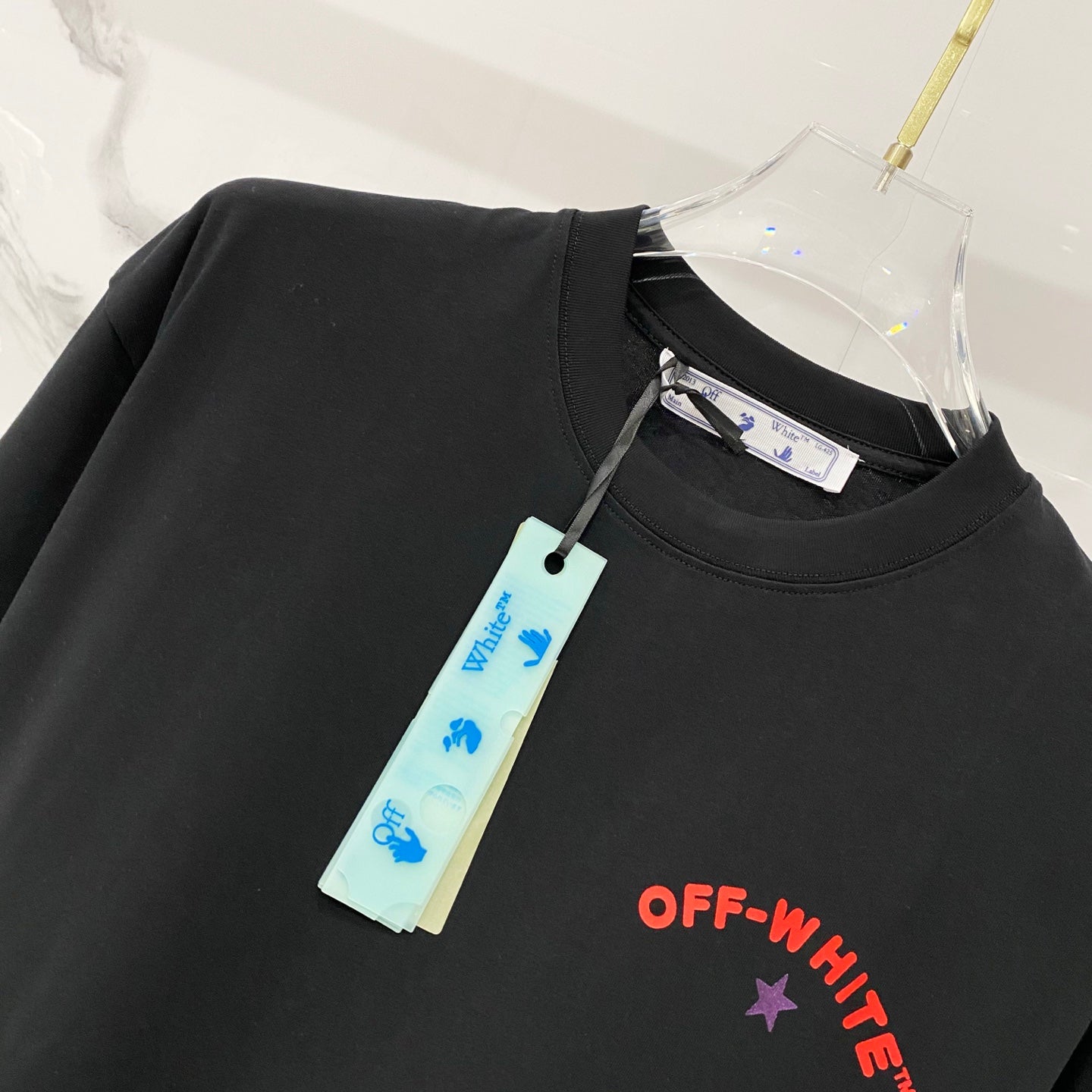 Off-White black T-shirt with hanging tag and small OFF-WHITE logo print