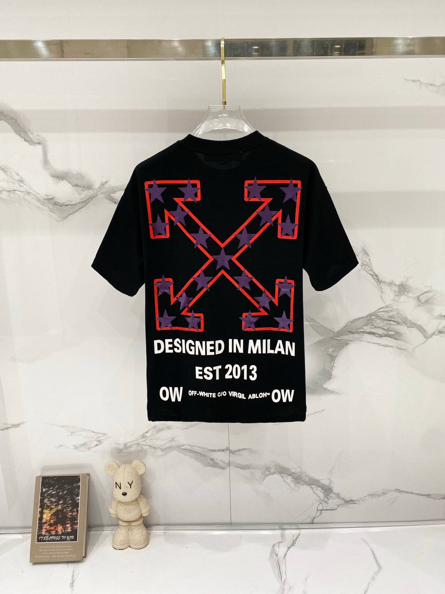 Off-White black T-shirt with red star graphic and "DESIGNED IN MILAN" text