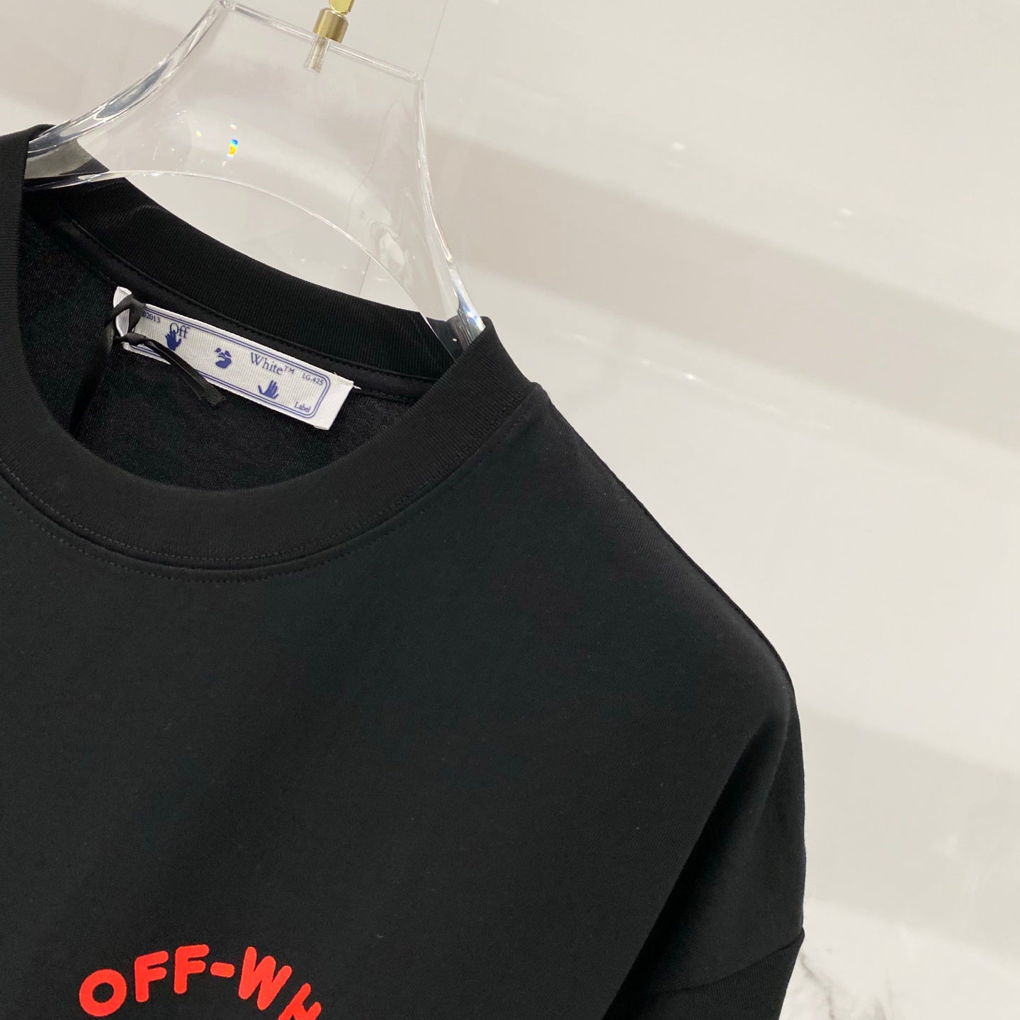 Off-White black T-shirt shoulder with size tag and OFF-WHITE logo print