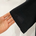 Off White black T-shirt sleeve hem and fabric texture close-up