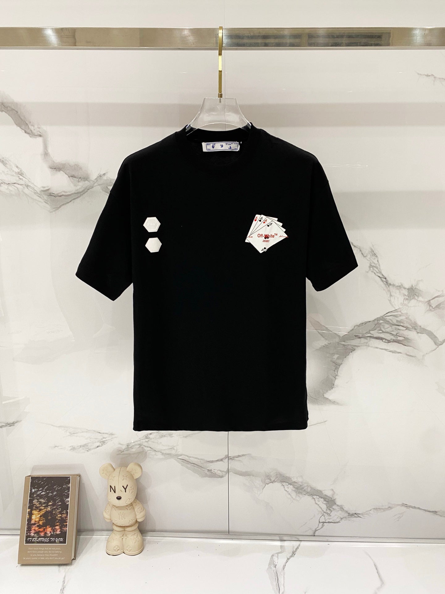 Off-White graphic T-shirt in dark color with small icon and card prints on front