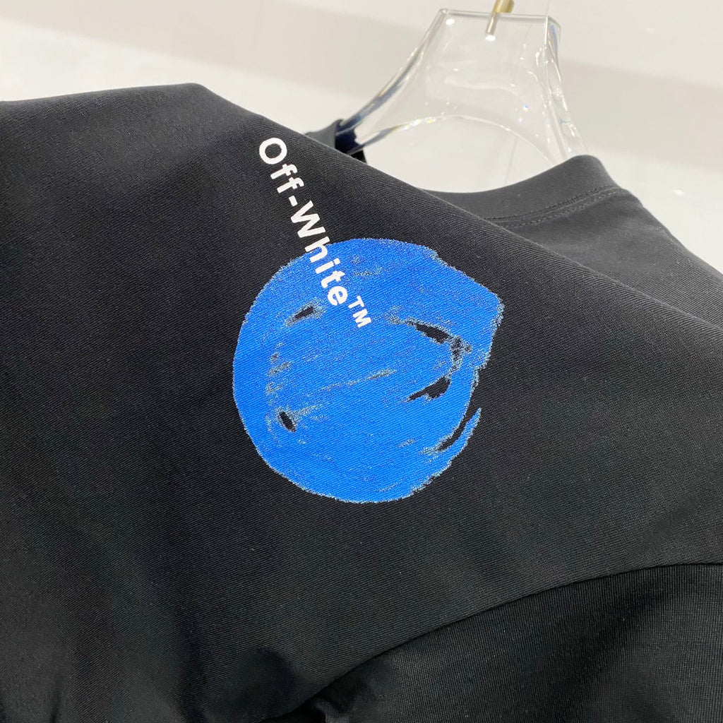 Off-White black T-shirt with blue circular graphic on the shoulder