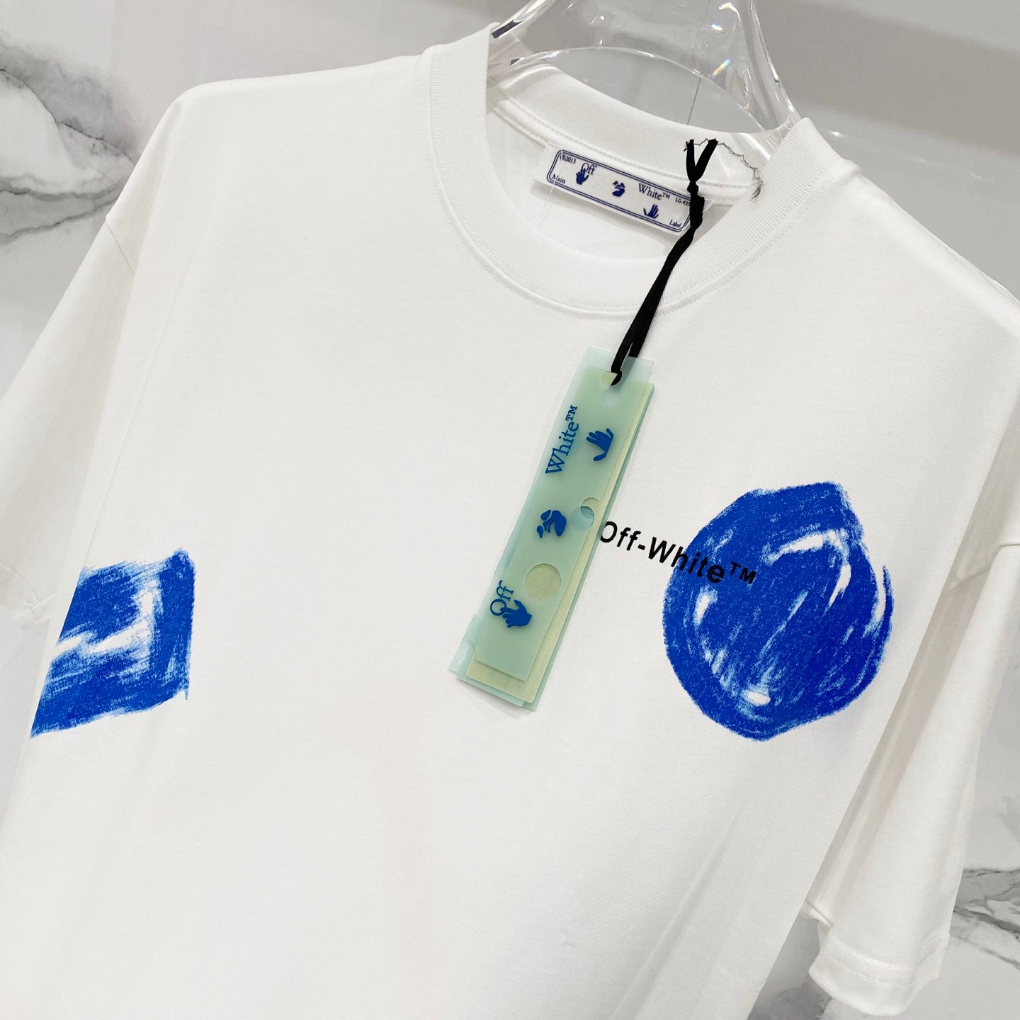 Off-White white T-shirt with blue brush logo graphics and neck tag