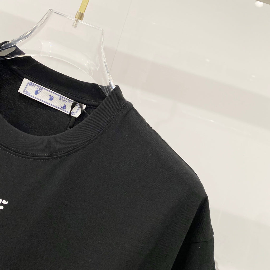 Black T-shirt with round collar and hanging size tag