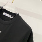 Black T-shirt with round collar and hanging size tag